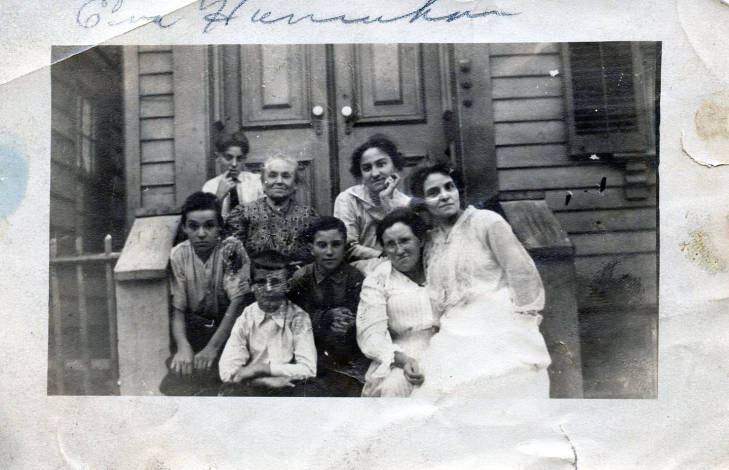 Eugenie and her family on their stoop
